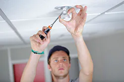 Installer connecting smart home lighting